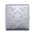 A square silver metal case with an ornate embossed floral and scroll pattern, shown closed on a plain white background.
