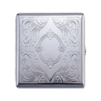 A square silver metal case with an ornate embossed floral and scroll pattern, shown closed on a plain white background.